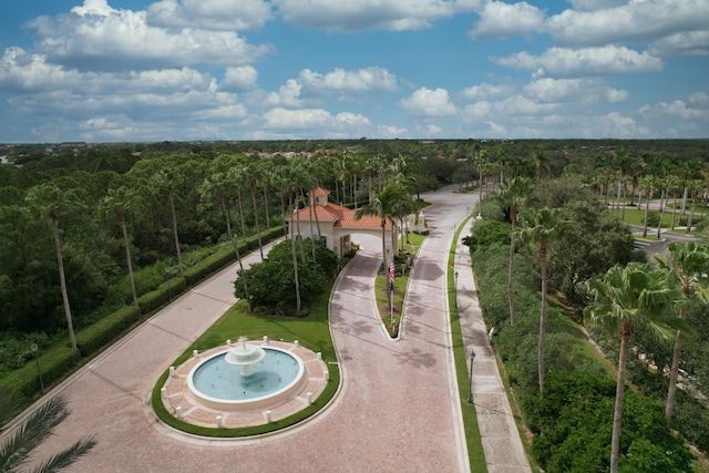 birds eye view of property with a view of trees