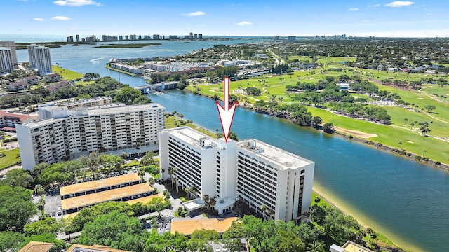 bird's eye view with a view of city, a water view, and golf course view