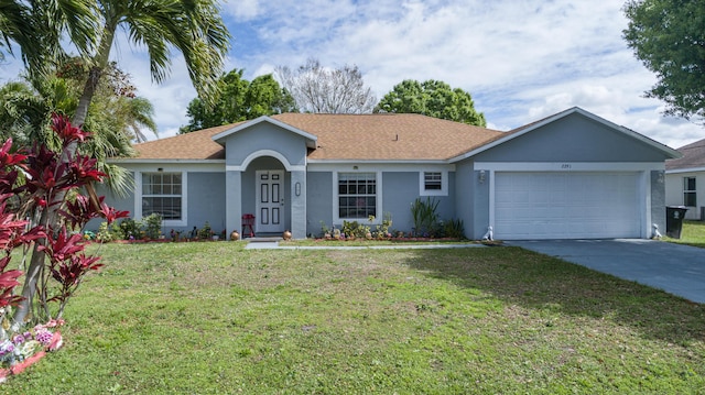 single story home featuring a garage, driveway, roof with shingles, stucco siding, and a front lawn