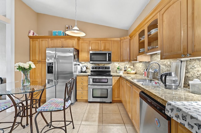 kitchen with tasteful backsplash, glass insert cabinets, stainless steel appliances, a sink, and light tile patterned flooring