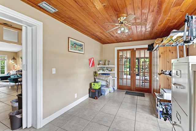 doorway to outside with light tile patterned flooring, wood ceiling, visible vents, and french doors