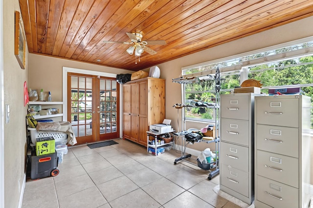 interior space with light tile patterned floors, ceiling fan, french doors, and wood ceiling