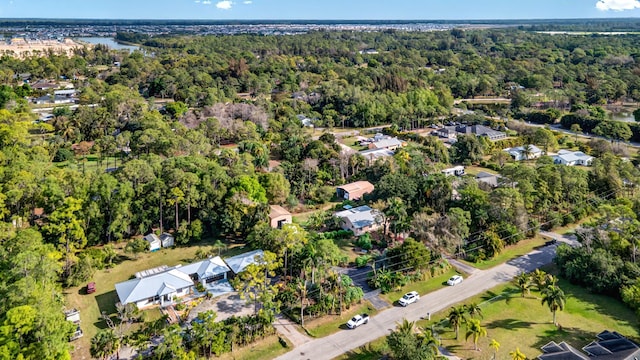 birds eye view of property with a forest view