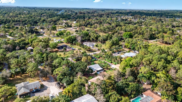 drone / aerial view featuring a forest view