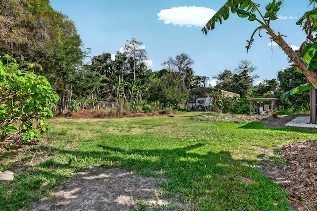 view of yard with a detached carport