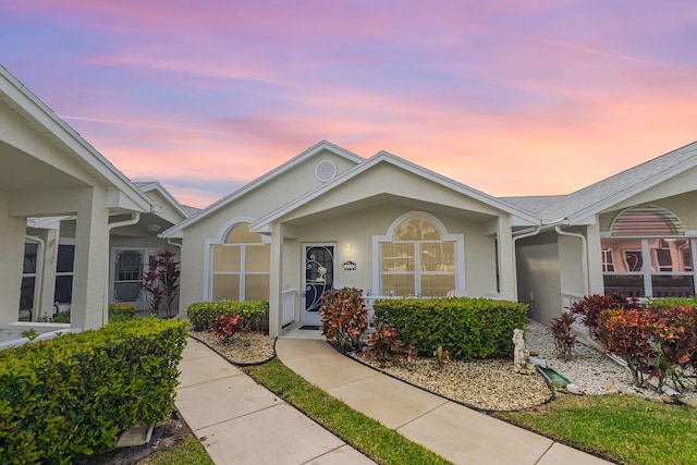 single story home featuring stucco siding