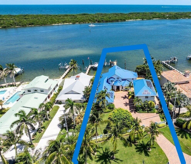 birds eye view of property featuring a residential view and a water view