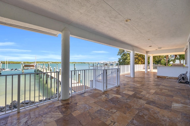 view of patio / terrace featuring a water view