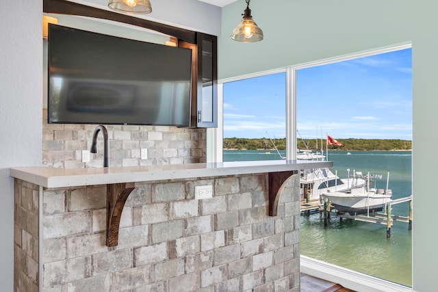 kitchen with hanging light fixtures and a healthy amount of sunlight