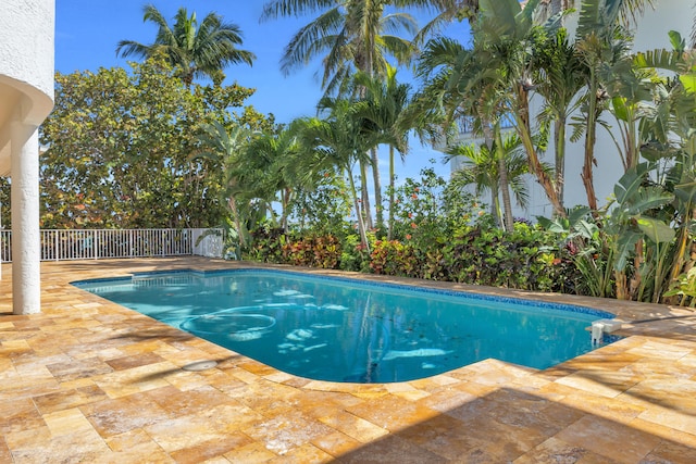 view of swimming pool with a fenced in pool, a patio area, and fence