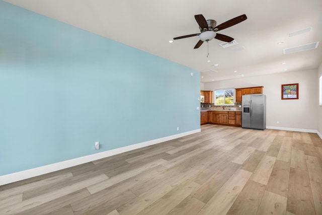 unfurnished living room featuring baseboards, visible vents, ceiling fan, light wood-type flooring, and recessed lighting