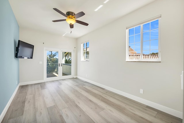 unfurnished room featuring ceiling fan, french doors, wood finished floors, and baseboards