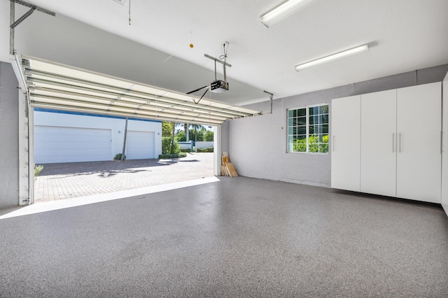 garage featuring a garage door opener