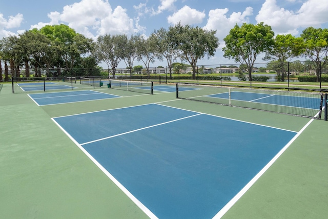 view of sport court featuring fence