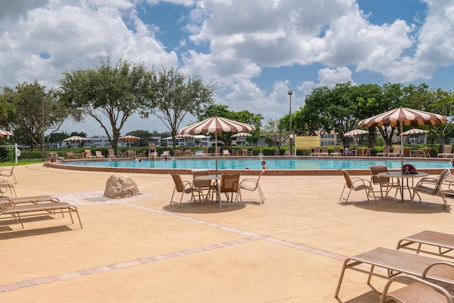 pool featuring a patio and fence