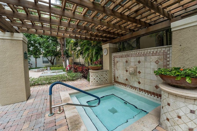 view of pool with a patio area and a pergola