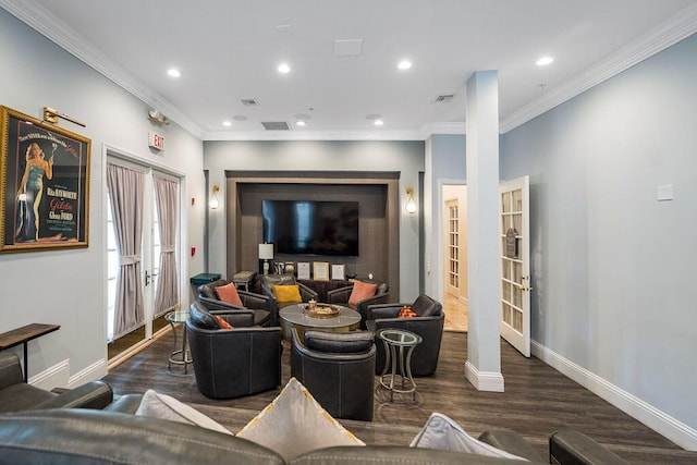 living room with crown molding, baseboards, and wood finished floors