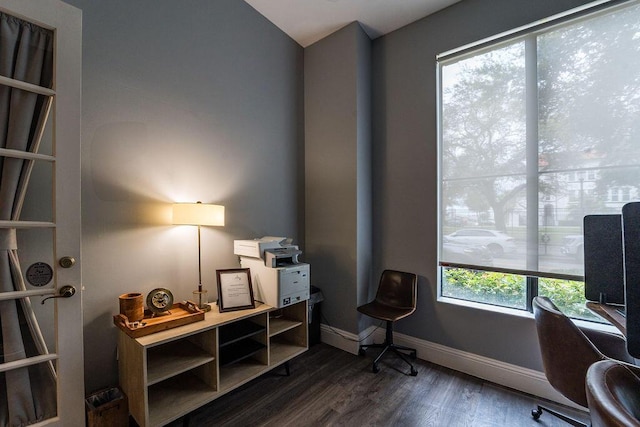 home office with baseboards and dark wood-style flooring