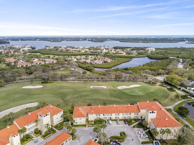 aerial view featuring a water view and golf course view