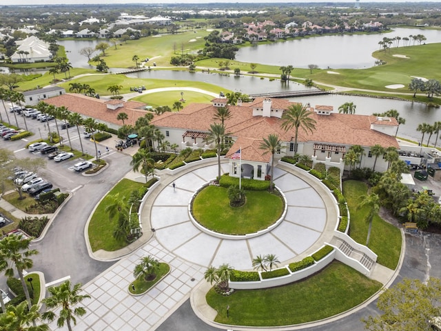 aerial view featuring a residential view, view of golf course, and a water view