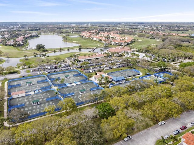 bird's eye view with a water view and golf course view