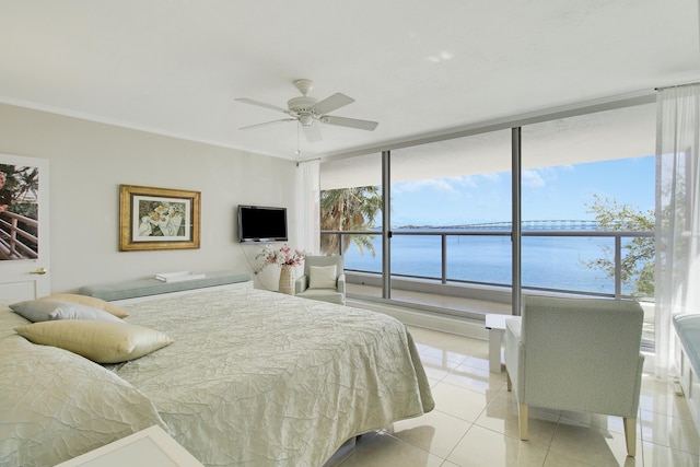 bedroom featuring light tile patterned floors, a ceiling fan, a wall of windows, and crown molding