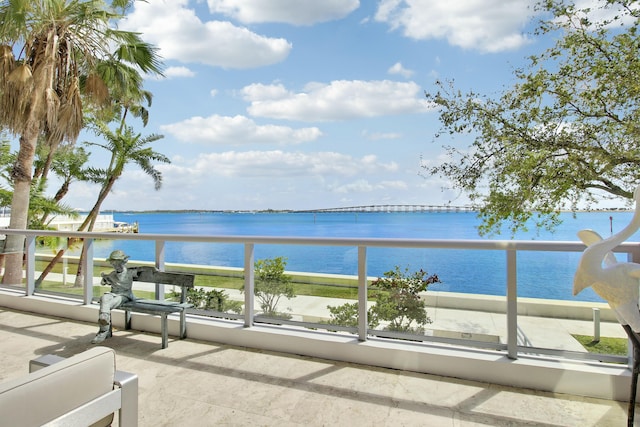 balcony featuring a water view