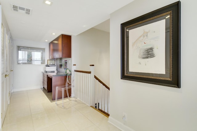 kitchen featuring light tile patterned floors, recessed lighting, visible vents, stove, and baseboards