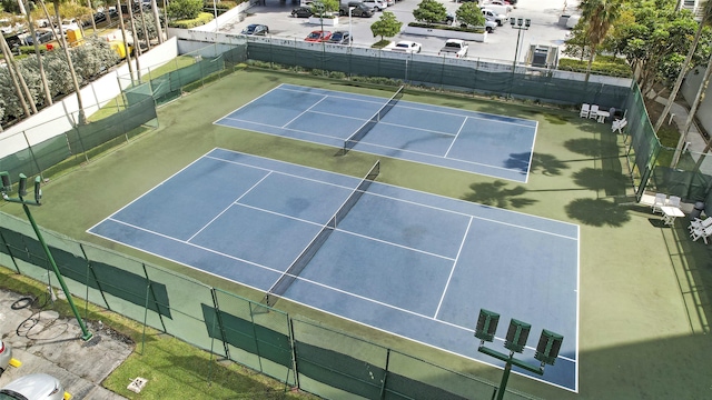 view of tennis court with fence