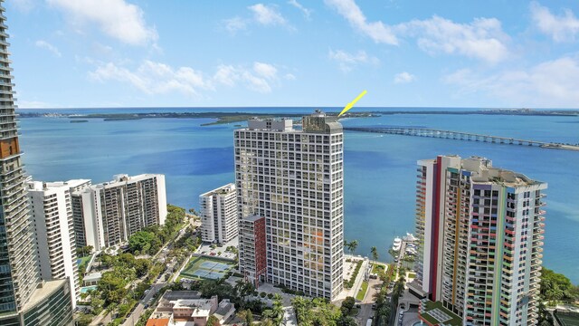 birds eye view of property featuring a view of city and a water view