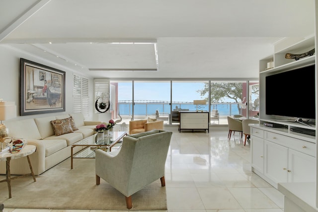 living area with a wall of windows, a healthy amount of sunlight, and light tile patterned floors