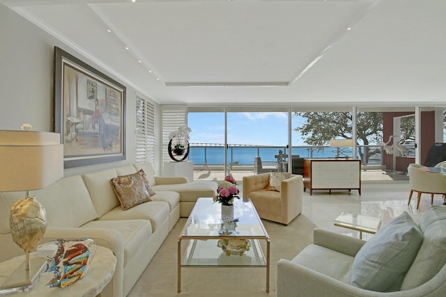 living room with a wall of windows, recessed lighting, and a water view