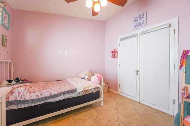 bedroom with light tile patterned flooring and a ceiling fan