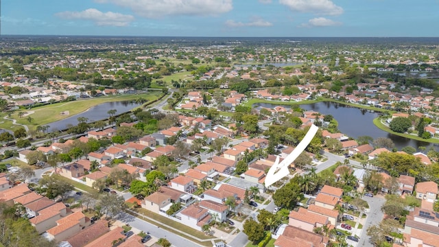 bird's eye view featuring a water view and a residential view