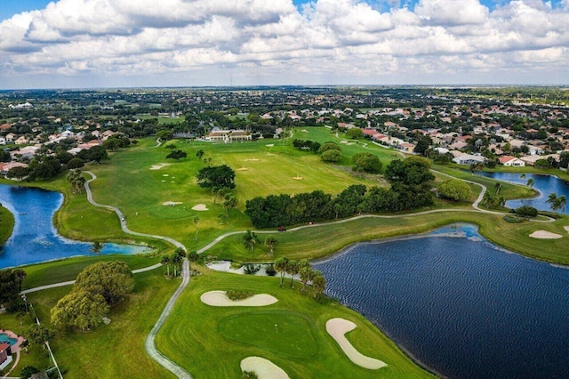 aerial view featuring a water view and view of golf course