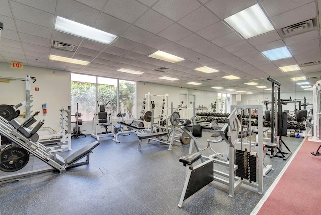 workout area with a paneled ceiling and visible vents