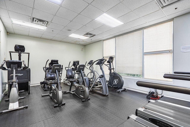 workout area featuring a paneled ceiling and visible vents