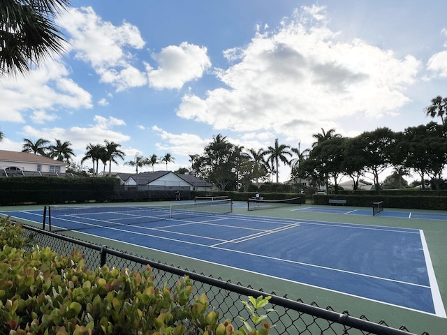 view of sport court with fence