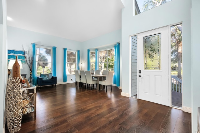 unfurnished dining area with wood-type flooring and baseboards