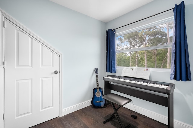 interior space with dark wood-style floors and baseboards