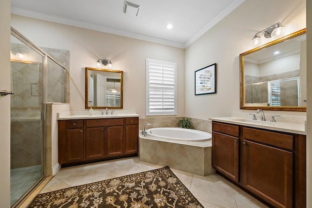 bathroom with two vanities, a sink, a shower stall, a bath, and crown molding