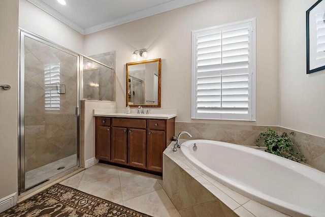 bathroom with ornamental molding, vanity, a shower stall, and a bath