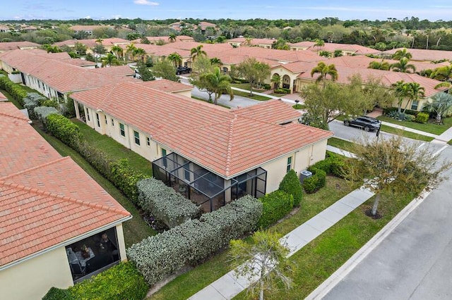 birds eye view of property with a residential view