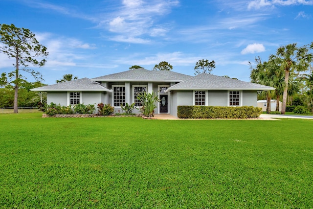 prairie-style house with a front lawn and stucco siding