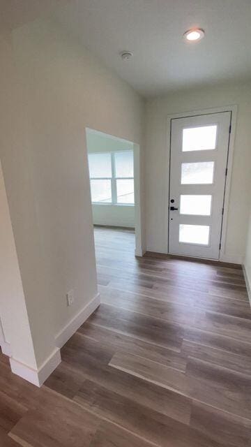 entrance foyer featuring recessed lighting, baseboards, and wood finished floors