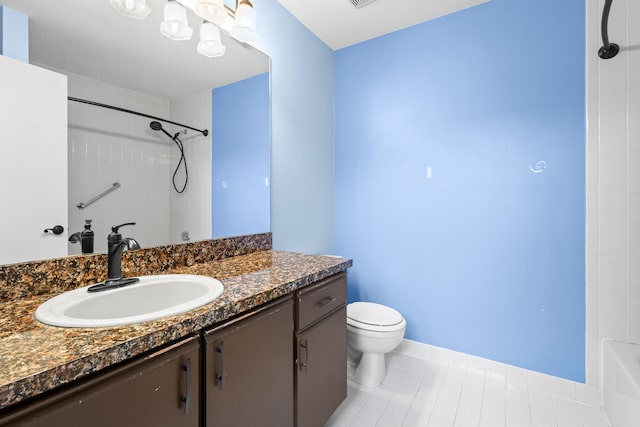 bathroom featuring washtub / shower combination, tile patterned flooring, vanity, and toilet