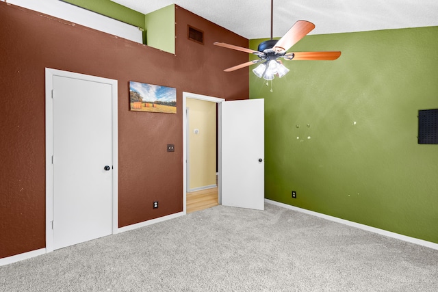 unfurnished bedroom featuring carpet floors, visible vents, and baseboards