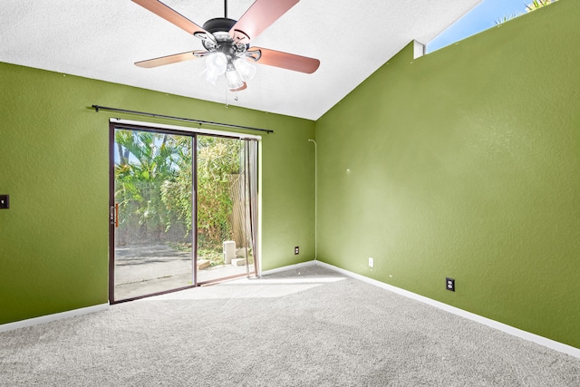 unfurnished room with a textured wall, carpet flooring, and baseboards