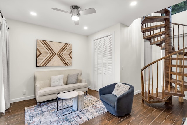 living area with baseboards, wood tiled floor, recessed lighting, ceiling fan, and stairs