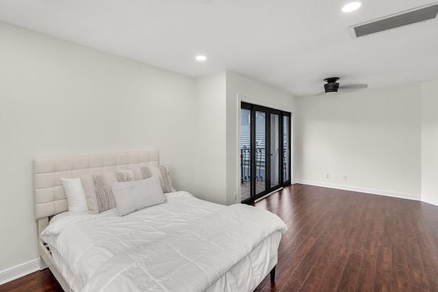 bedroom featuring visible vents, dark wood finished floors, recessed lighting, baseboards, and access to exterior